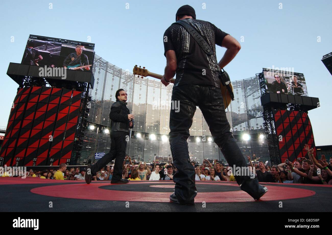U2 Concert - Twickenham Stadium. The Edge (right) and Bono from Irish rock group U2 perform onstage. Stock Photo