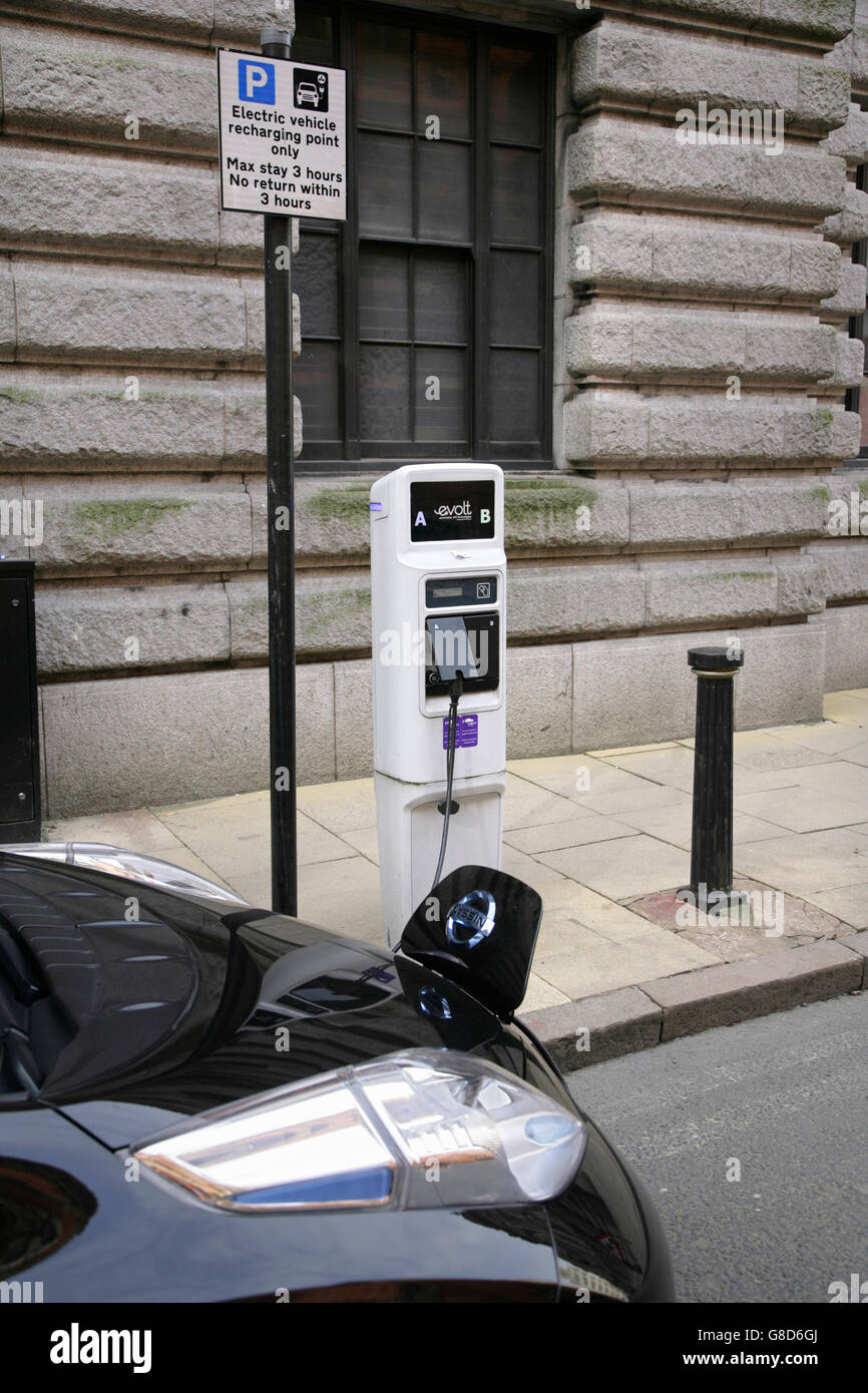 Nissan Leaf electric car being recharged in Birmingham city centre, UK