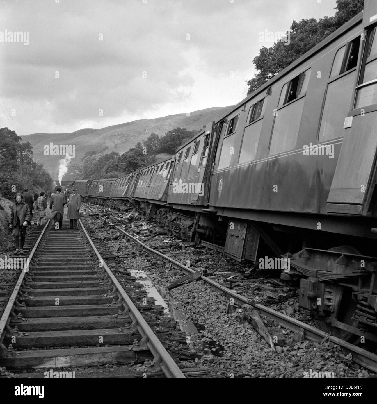 Titled coaches and debris strewn across the track after the Glasgow-Euston express train had been derailed by a landslide at Glenairlie Bridge, between Sanquhar and Carronbridge, Dumfriesshire. None of the 272 passengers were injured. The landslide occurred during the storm that hit West Scotland last night. Stock Photo