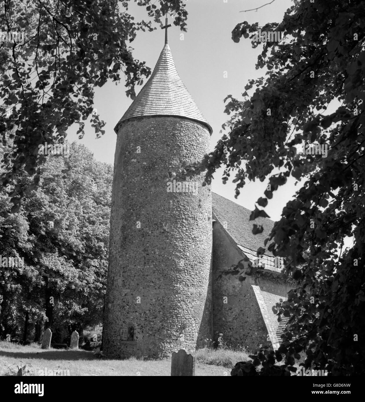The little flint church at Southease, near Lewes, Sussex, which predates the Norman Conquest and is now celebrating 1,000 years of recorded history. The Round Tower and most of the present building is Norman, but some parts of the ancient structure remain. Stock Photo