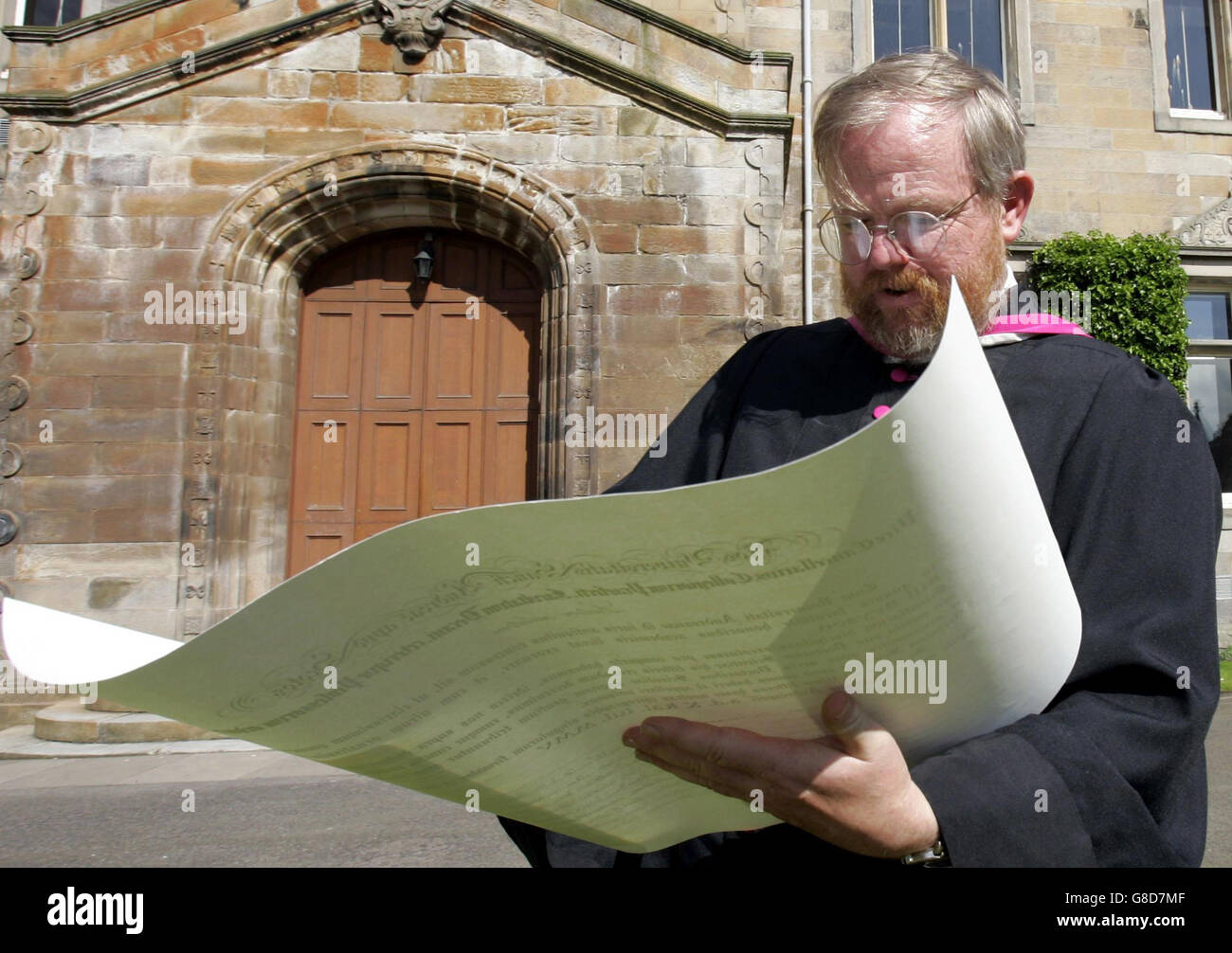 Author Bill Bryson looks at his scroll after he became a Doctor of ...