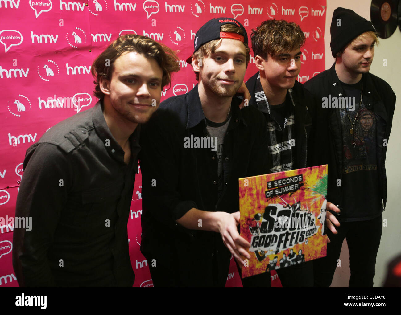 Australian band 5 Seconds of Summer (left to right) Ashton Irwin, Luke Hemmings, Calum Hood and Michael Clifford during a signing session at HMV Glasgow for their new album, Sounds Good Feel Good. Stock Photo