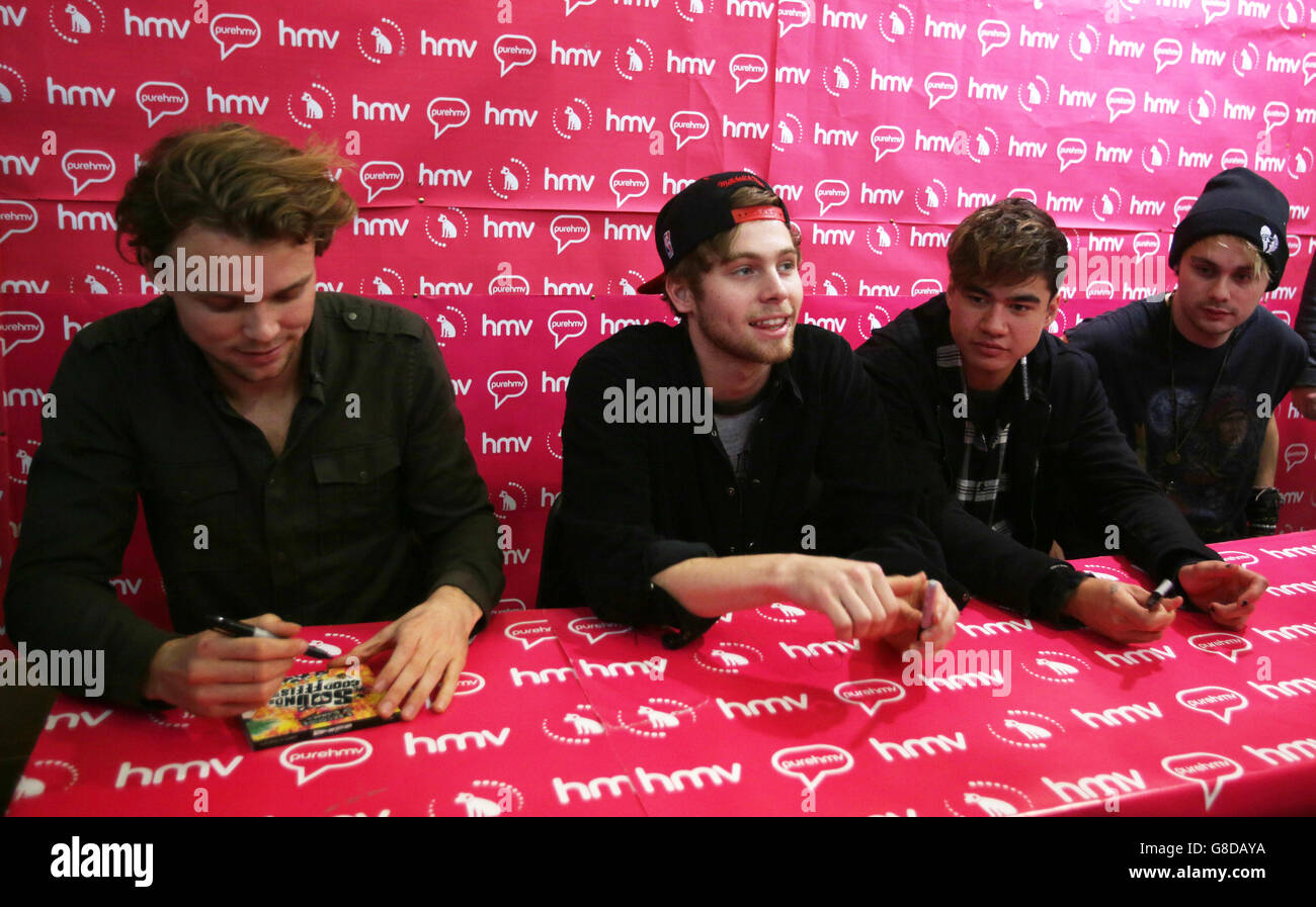 Australian band 5 Seconds of Summer (left to right) Ashton Irwin, Luke Hemmings, Calum Hood and Michael Clifford during a signing session at HMV Glasgow for their new album, Sounds Good Feel Good. Stock Photo