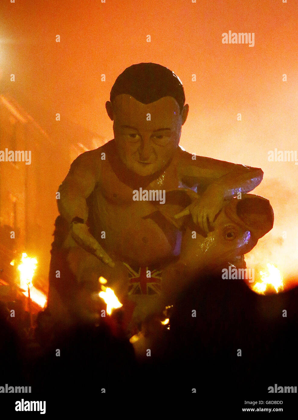 An effigy of Prime Minister David Cameron is paraded through the town ...