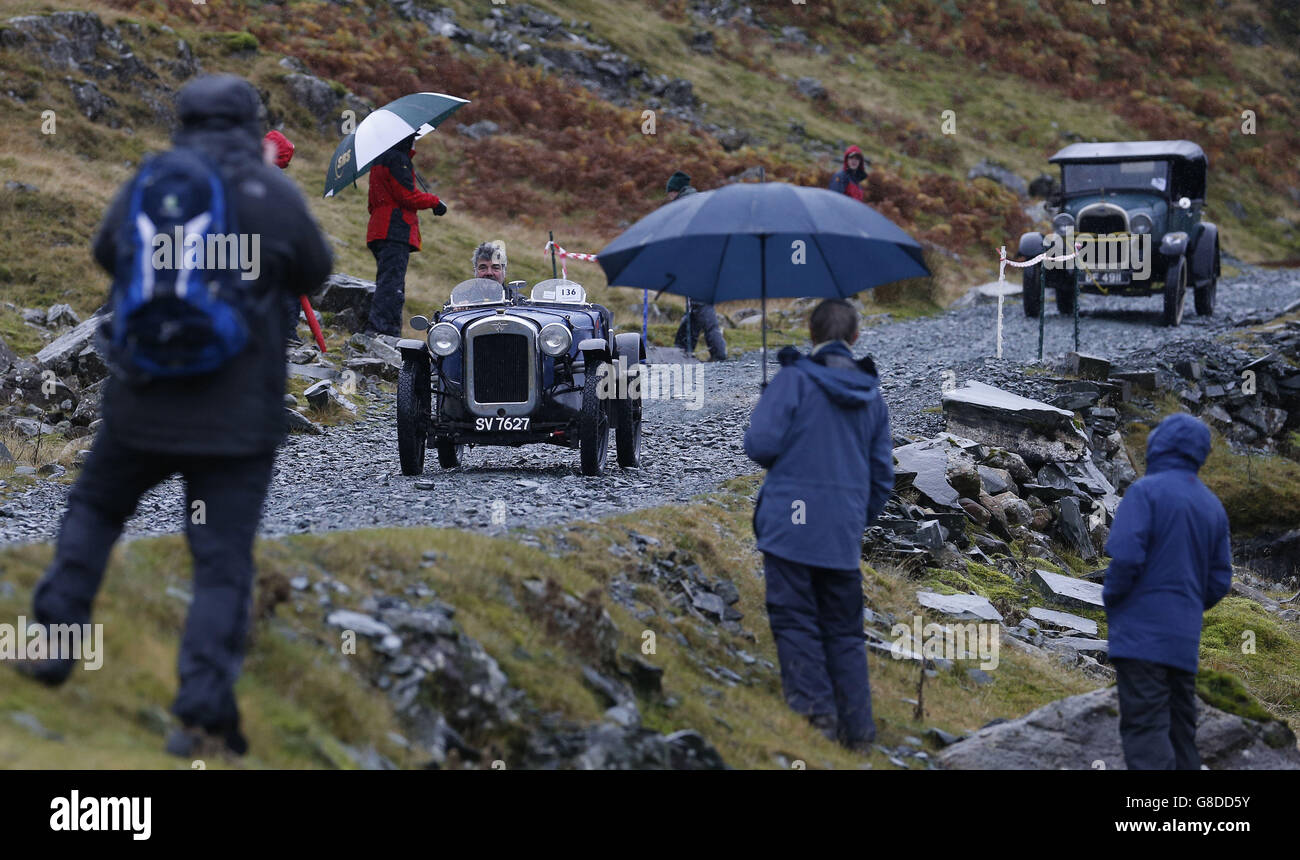 Vintage cars are driven along the quarry road at Honister Slate Mine
