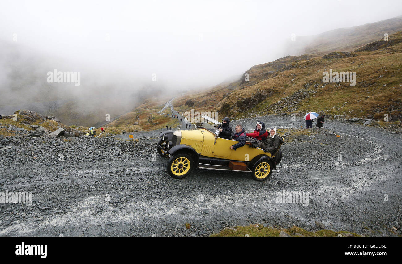 A vintage 1926 Morris Cowley car is driven along the quarry road at Honister Slate Mine, in Borrowdale, Keswick, Cumbria, as it takes part in the annual Lakeland Trials vintage car rally. Stock Photo