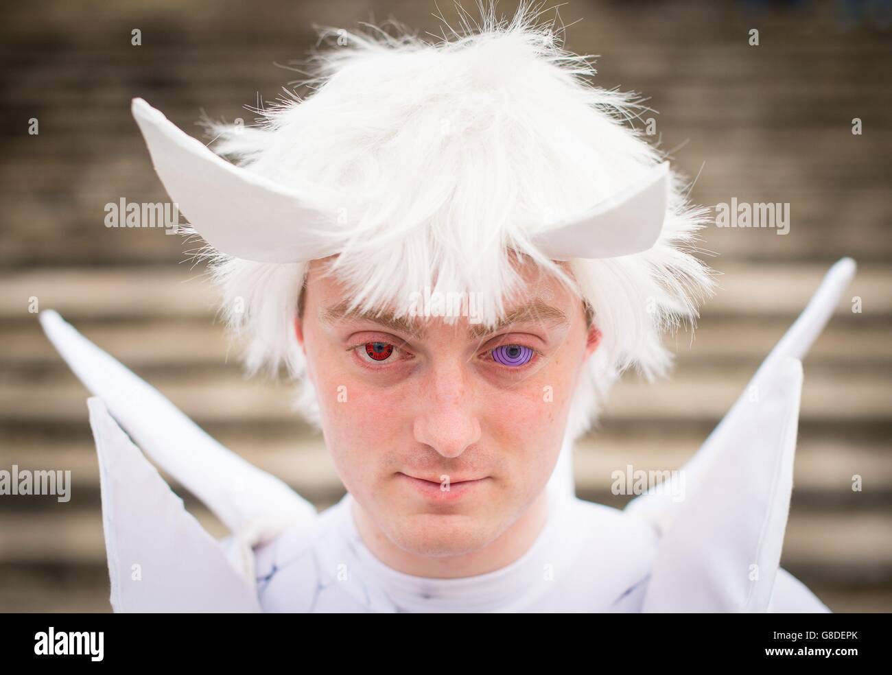 Liam Fitzgerald dressed as Obito, from the Naruto manga series at the MCM London Comic Con at ExCeL London. Stock Photo