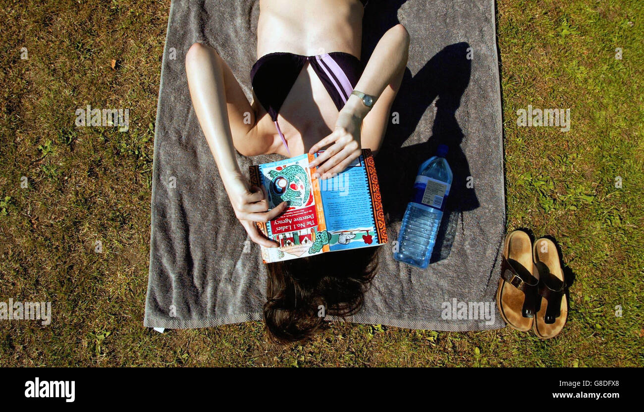 Girl sunbathing reading above hires stock photography and images Alamy