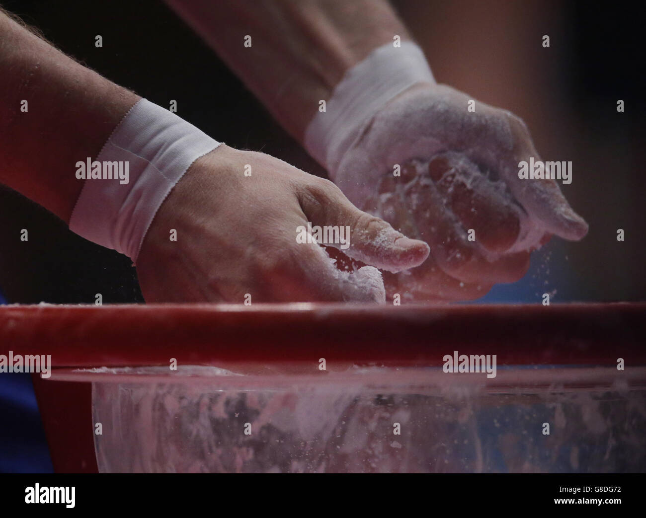 A general view of an athlete putting chalk on their hands during day four of the 2015 World Gymnastic Championships at The SSE Hydro, Glasgow. PRESS ASSOCIATION Photo. Picture date: Monday October 26, 2015. Photo credit should read: Danny Lawson/PA Wire. RESTRICTIONS: Strictly no commercial use or association without prior permission from gymnast or their agent. No image sequences in excess of 5 images per second. Call +44 (0)1158 447447 for further info. Stock Photo