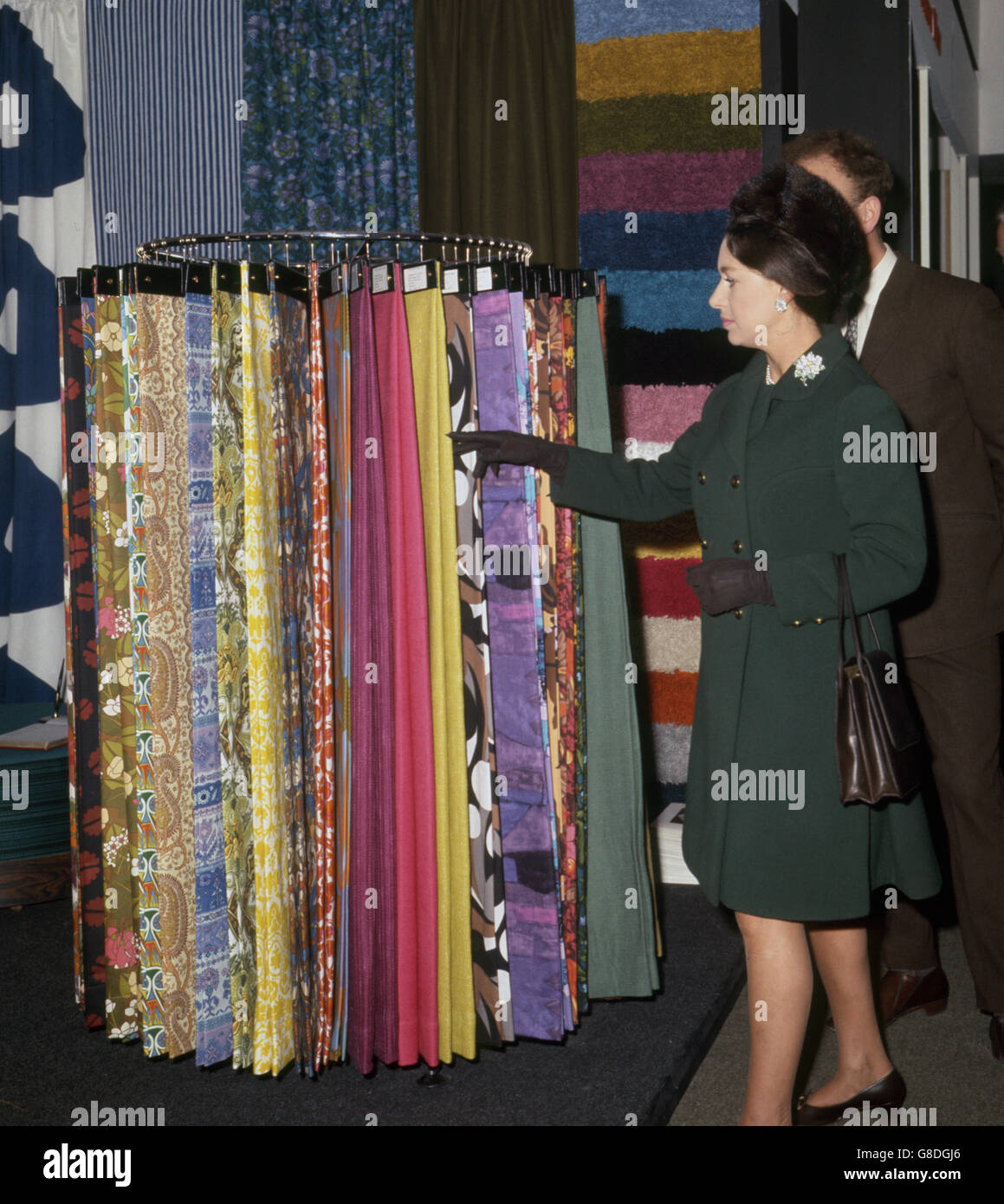 Princess Margaret looks at fabrics at the 46th Daily Mail Ideal Home Exhibition at the Olympia London, which she opened. Stock Photo
