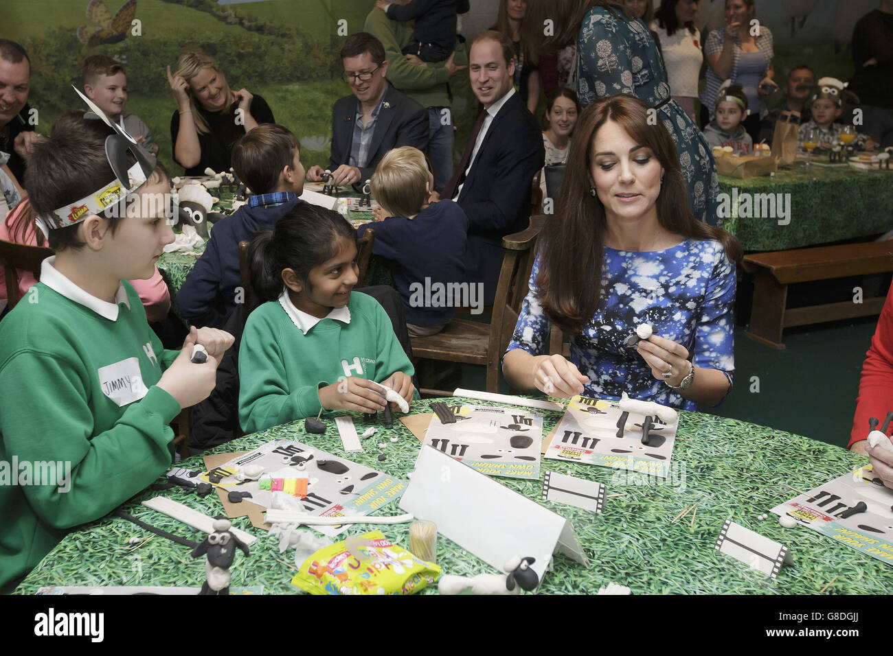 The Duchess of Cambridge makes a model of animated character Shaun the Sheep, with children and representatives from charities and Aardman Animations, during a meeting of the Charities Forum at BAFTA on Piccadilly in London. Stock Photo