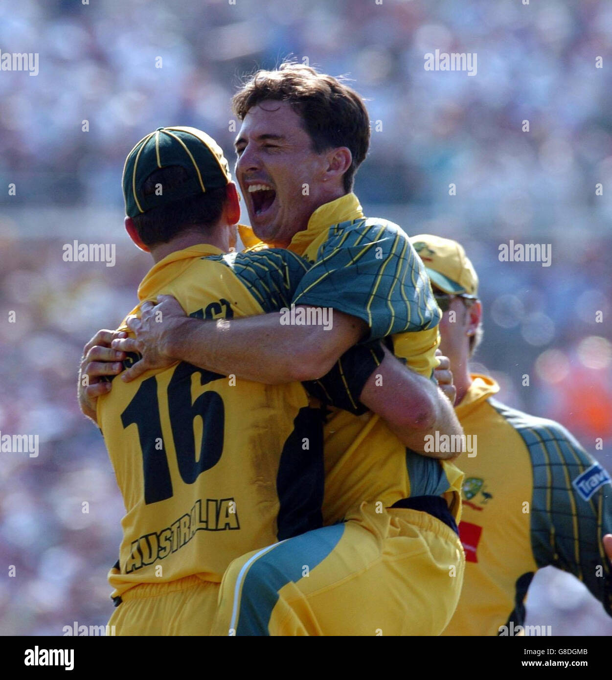 Australia's Brad Hogg (R) celebrates the wicket of England's Andrew Flintoff with Michael Kasprowicz. Stock Photo