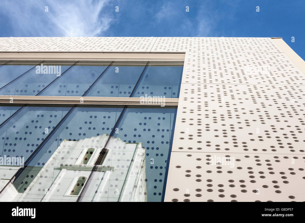 Badajoz, Spain - June 19, 2016: MUBA Museum building. Prestressed cement skin and perforated white with reflections Stock Photo