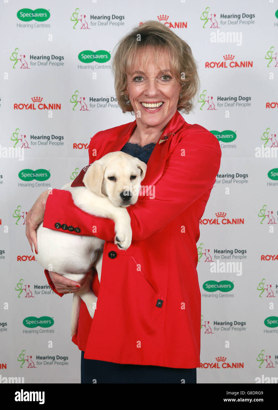 Dame Esther Rantzen with a hearing dog puppy, at The Hearing Dogs