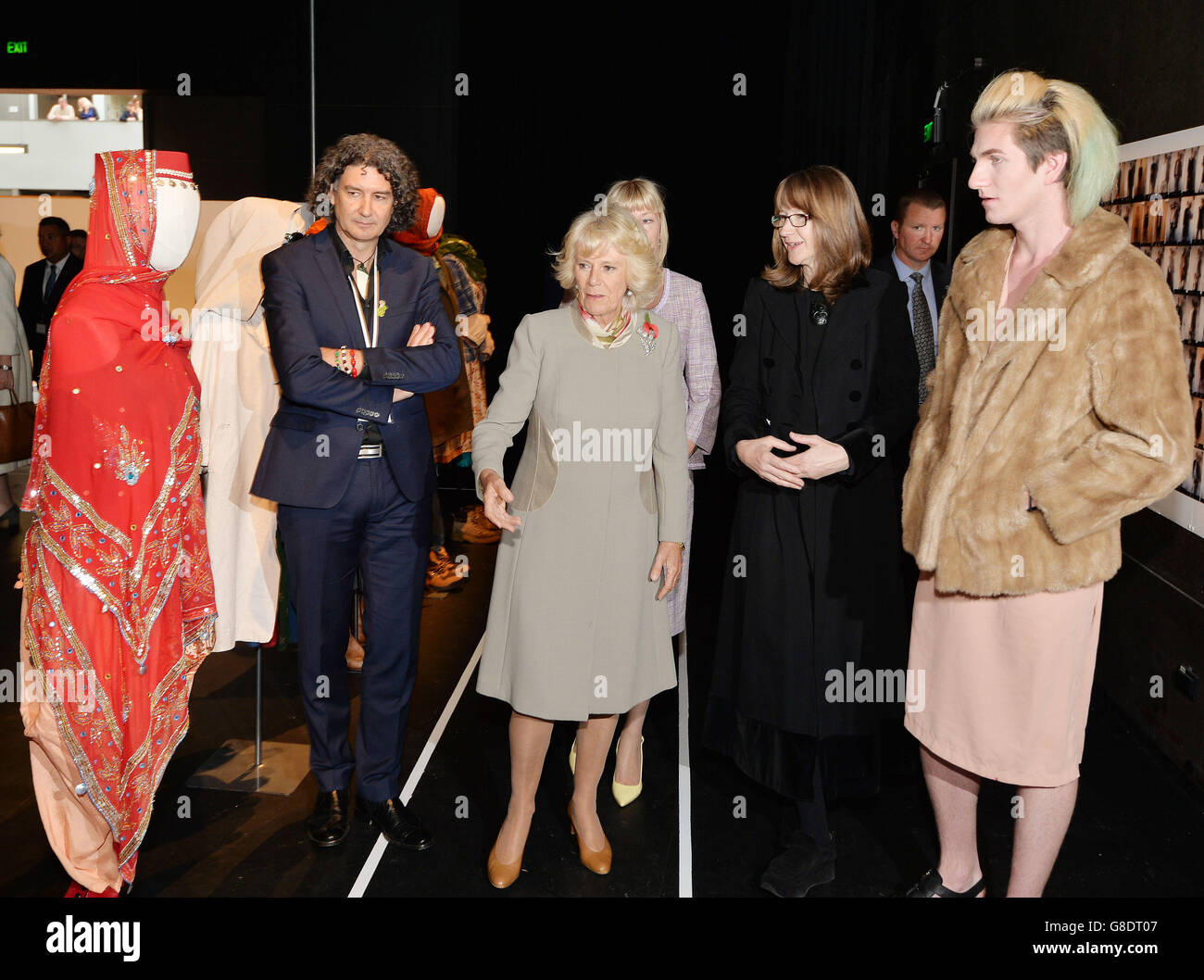 The Duchess of Cornwall looks at some of the costumes made for Theatre productions, which was shown to her by designer Jasper Powell (right), at the Toi Whakaari New Zealand Drama School, on the outskirts of Wellington, during the second day of a week long tour with the Prince of Wales to New Zealand. Stock Photo