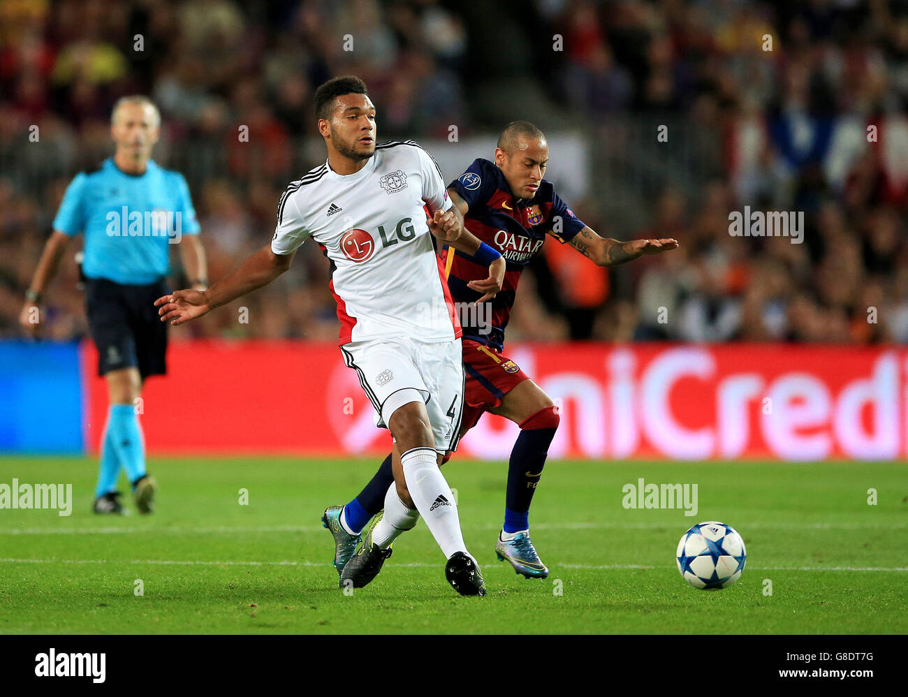 Bayer Leverkusen's Jonathan Tah (left) and Barcelona's Neymar battle for the ball. Stock Photo