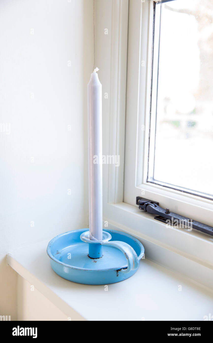 blue candlestick in window Stock Photo Alamy
