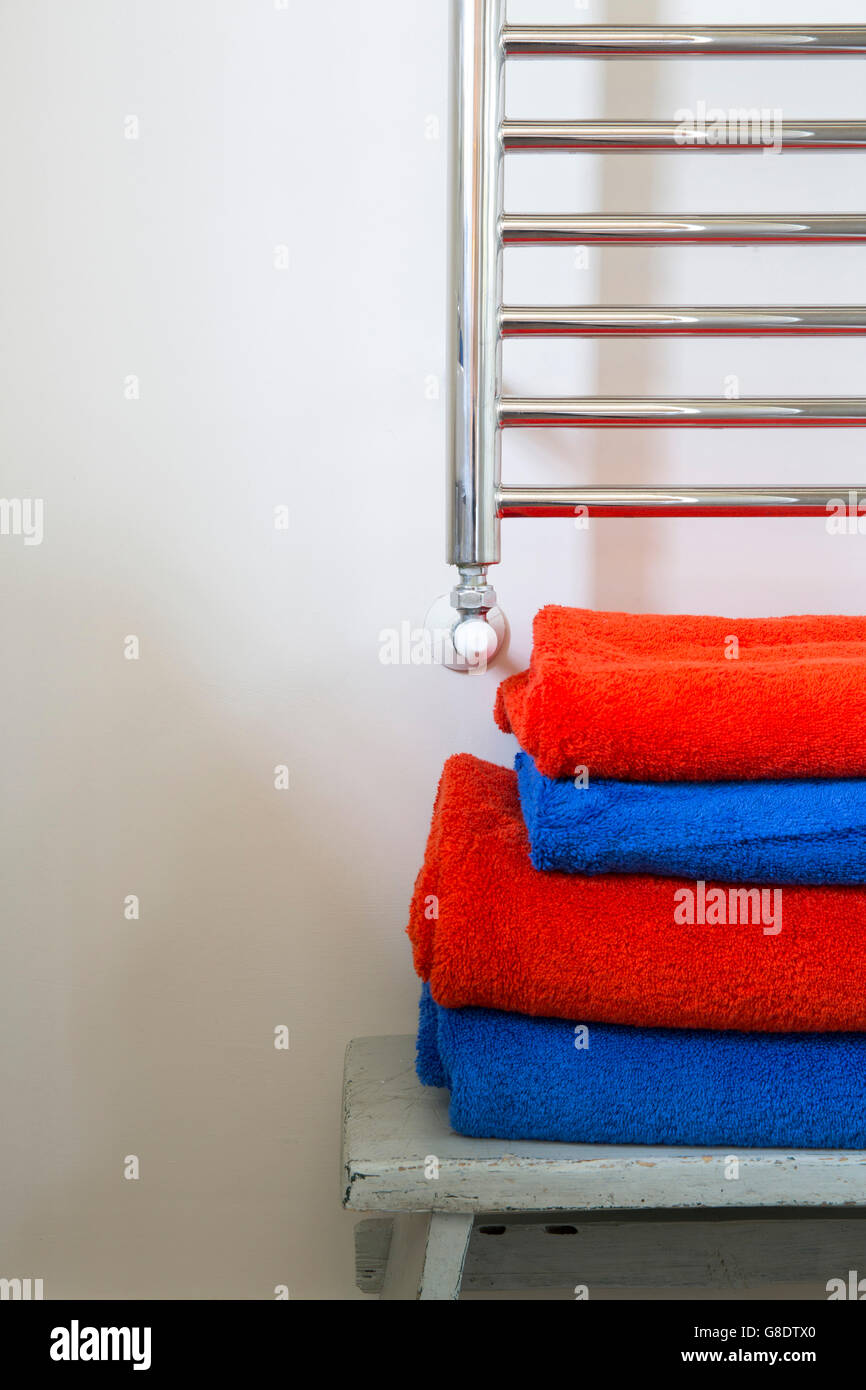 bathroom towels and chrome radiator Stock Photo