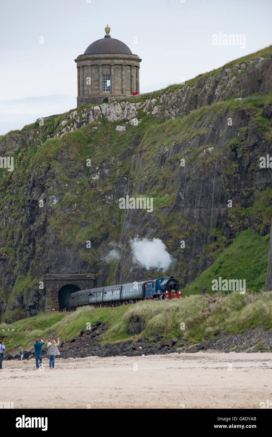 HM The Queen and Prince Philip, The Duke of Edinburgh on a steam train below Mussenden Temple during a Royal visit to Northern Ireland Stock Photo