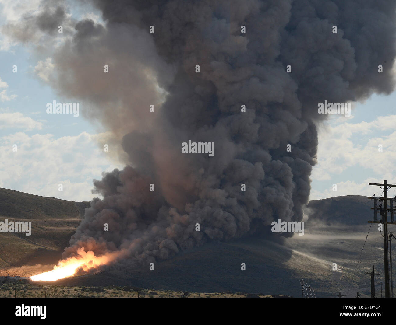 June 28, 2016. Promontory UT. Raw fire power is blasted into a hillside as ATK test fires a solid rocket booster motor that burns 6 tons of propellant each second with expanding gases and flames exiting the nozzle at speeds in excess of Mach 3 and temperatures reaching 3,700 degrees Fahrenheit Tuesday. Orbital ATK test fire happen at 9:05am MT time and NASA will use measurements from more than 530 data channels to evaluate motor performance, acoustics, motor vibrations, nozzle modifications, insulation upgrades. Photo by Gene Blevins/LA DailyNews/ZumaPress. (Credit Image: © Gene Blevins via Stock Photo