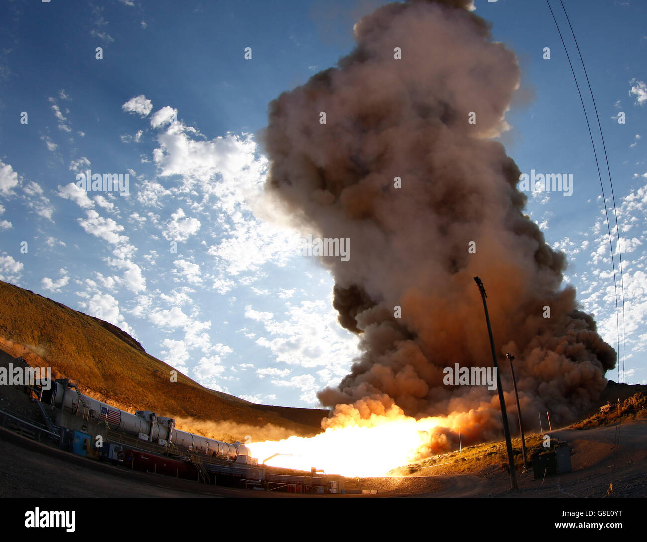 Promontory, Utah, USA. 28th June, 2016. Raw fire power is blasted into a hillside as ATK test fires a solid rocket booster motor that burns 6 tons of propellant each second with expanding gases and flames exiting the nozzle at speeds in excess of Mach 3 and temperatures reaching 3,700 degrees Fahrenheit Tuesday. Orbital ATK test fire happen at 9:05am MT time and NASA will use measurements from more than 530 data channels to evaluate motor performance, acoustics, motor vibrations, nozzle modifications, insulation upgrades. Credit:  ZUMA Press, Inc./Alamy Live News Stock Photo