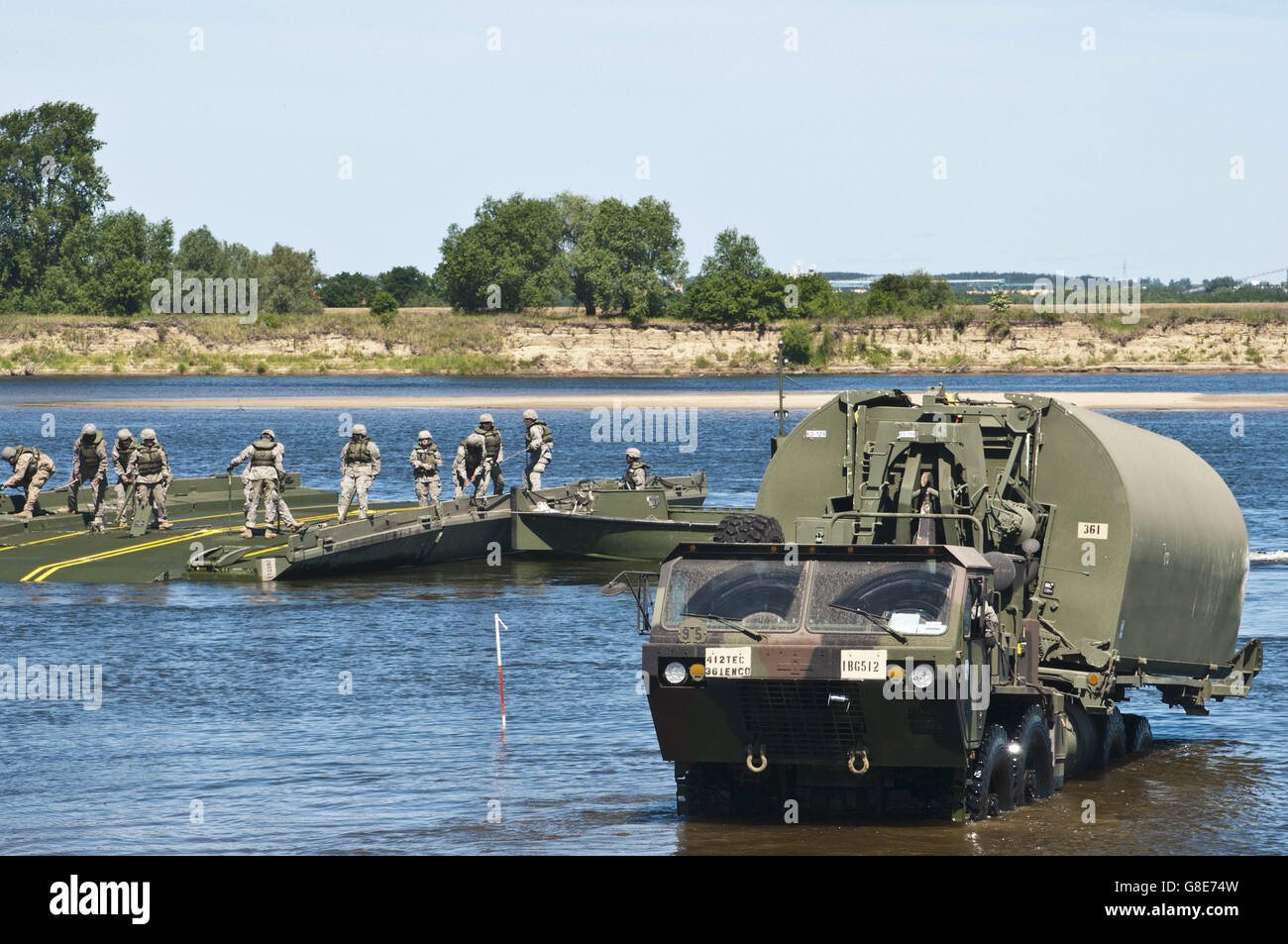 June 7, 2016 - Chelmno, Poland - U.S. Army Reserve Soldiers with the 361st Engineer Company from Warner Robins, Ga., sharpen their skills by constructing the Improved Ribbon Bridge on the Vistula River in Chelmno, Poland, as a part of Exercise Anakonda 2016, June 7. The IRB is a sectional floating bridge that can be used to create a full bridge or to ferry vehicles and equipment across a body of water. Exercise Anakonda 2016 is a Polish-led, joint, multinational exercise taking place in Poland from June 7-17. This exercise involves more than 31,000 participants from more than 20 nations. Exerc Stock Photo
