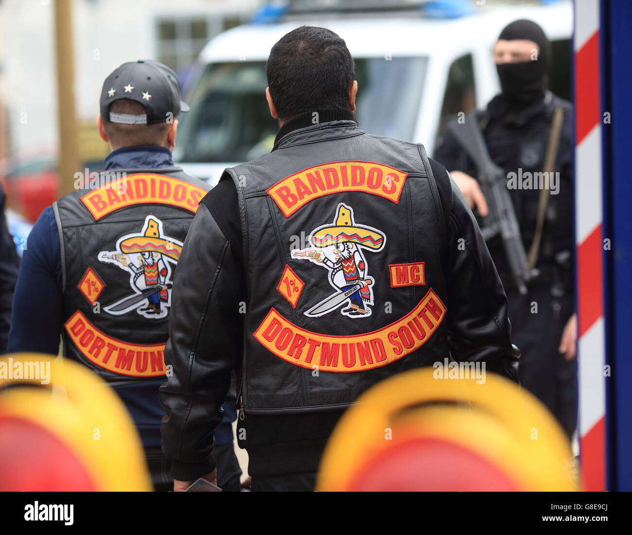 Magdeburg, Germany. 2nd July, 2016. Policemen in ski masks controlling bikers at a road checkpoint during a biker meeting in the South West of Magdeburg, Germany, 2 July 2016. A massive police platoon controls a meeting of the biker gang Bandidos. PHOTO: JENS WOLF/dpa/Alamy Live News Stock Photo