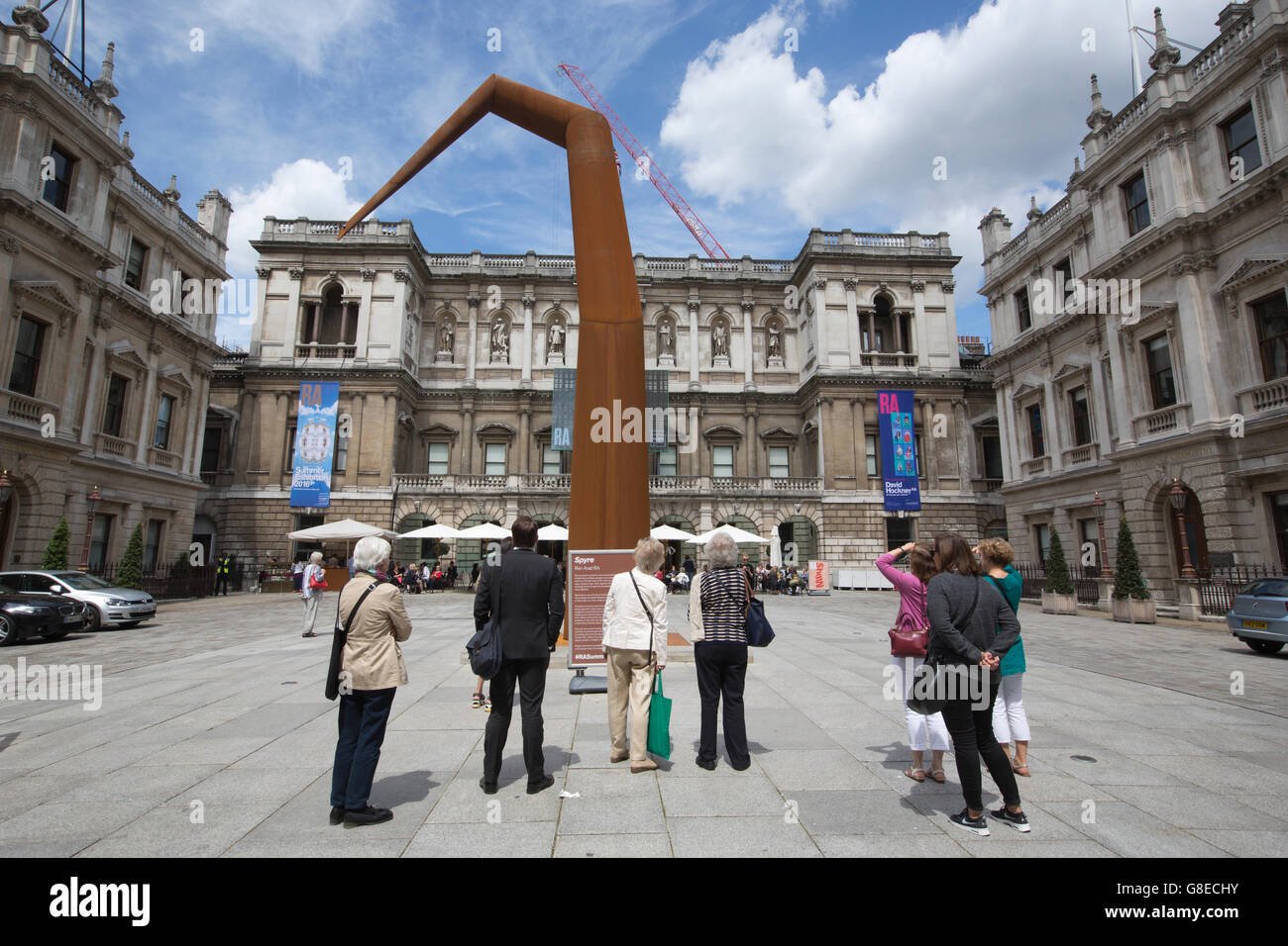 People viewing 'SPYRE' by artist Ron Arad exhibited in the Royal Academy of Arts courtyard, Piccadilly, London, England, UK Stock Photo