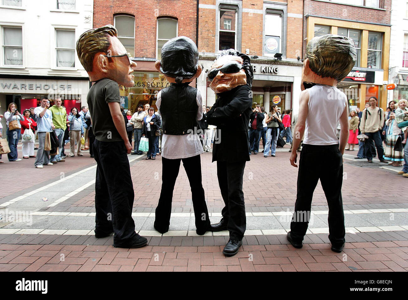 Actors dressed as Irish supergroup U2 perform ahead of the first of their three Vertigo tour sell-out gigs at Croke Park. Stock Photo