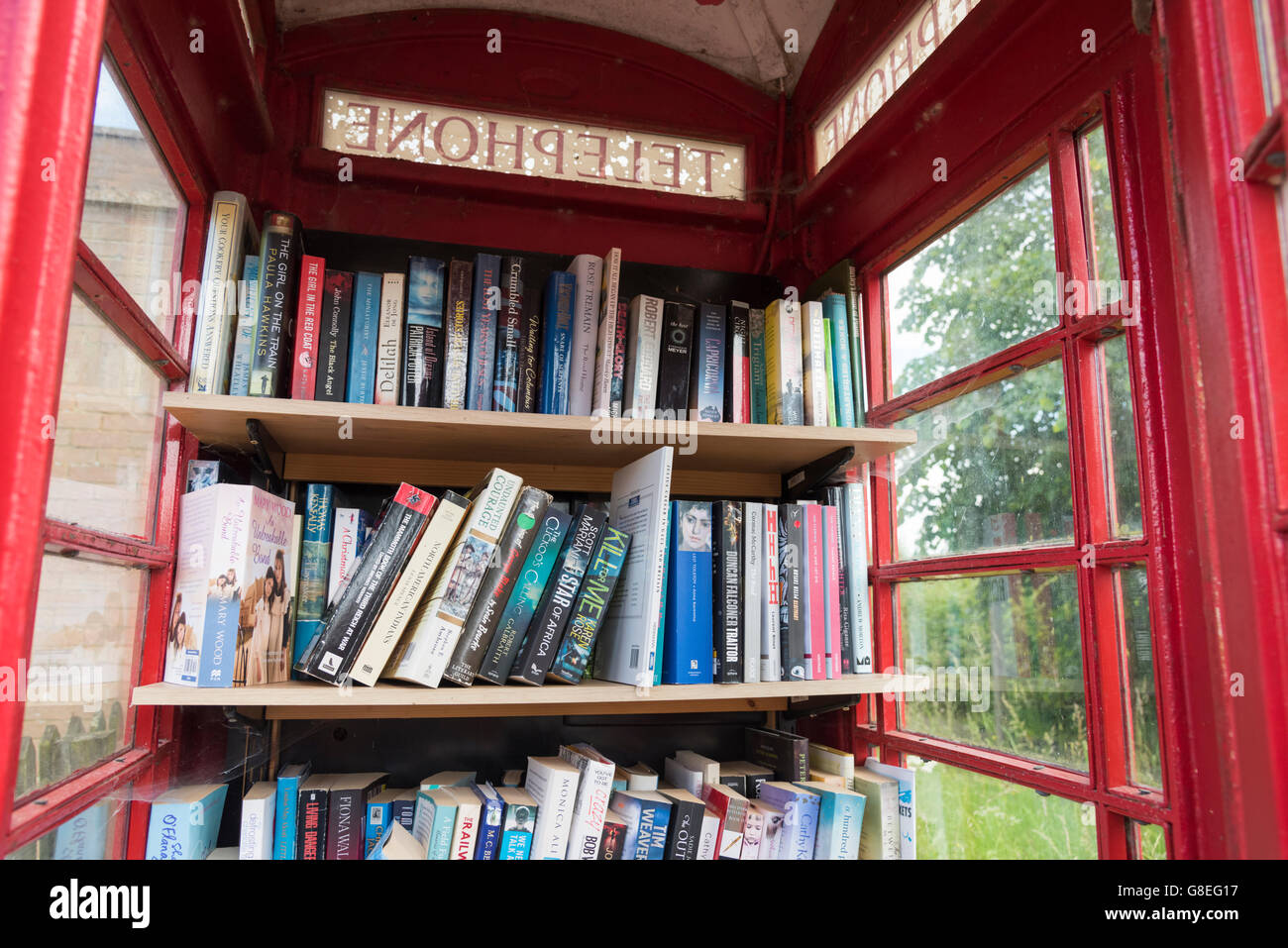 A community library in a disused red telephone box in the UK Stock ...
