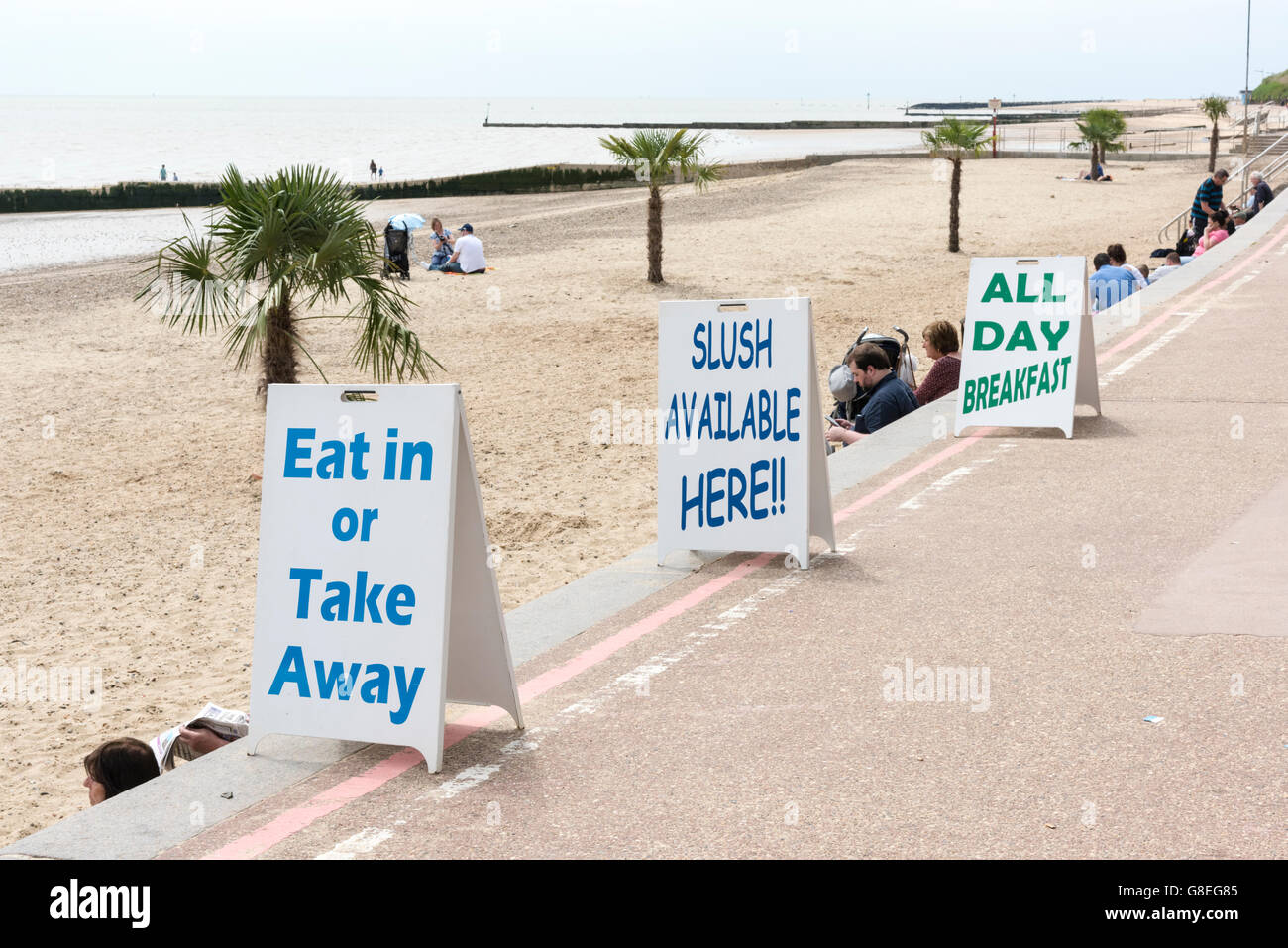 Signs for takeaway food and slush drinks at Clacton beach UK Stock Photo