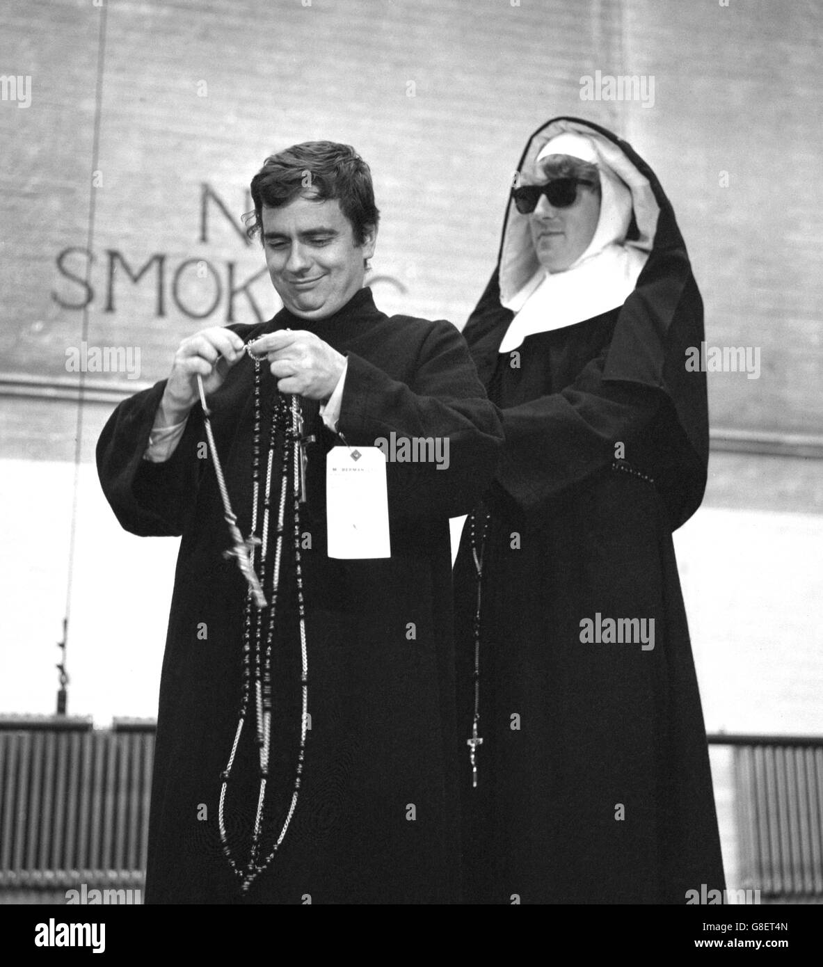 Dudley Moore (left) and Peter Cook rehearse their 'Leaping Nuns' sketch for Cook's revue Rustle of Spring at the Phoenix Theatre, London. The revue opens there on Friday to raise money for the magazine Private Eye to help defray costs of the libel action against it by Lord Russell of Liverpool. Stock Photo