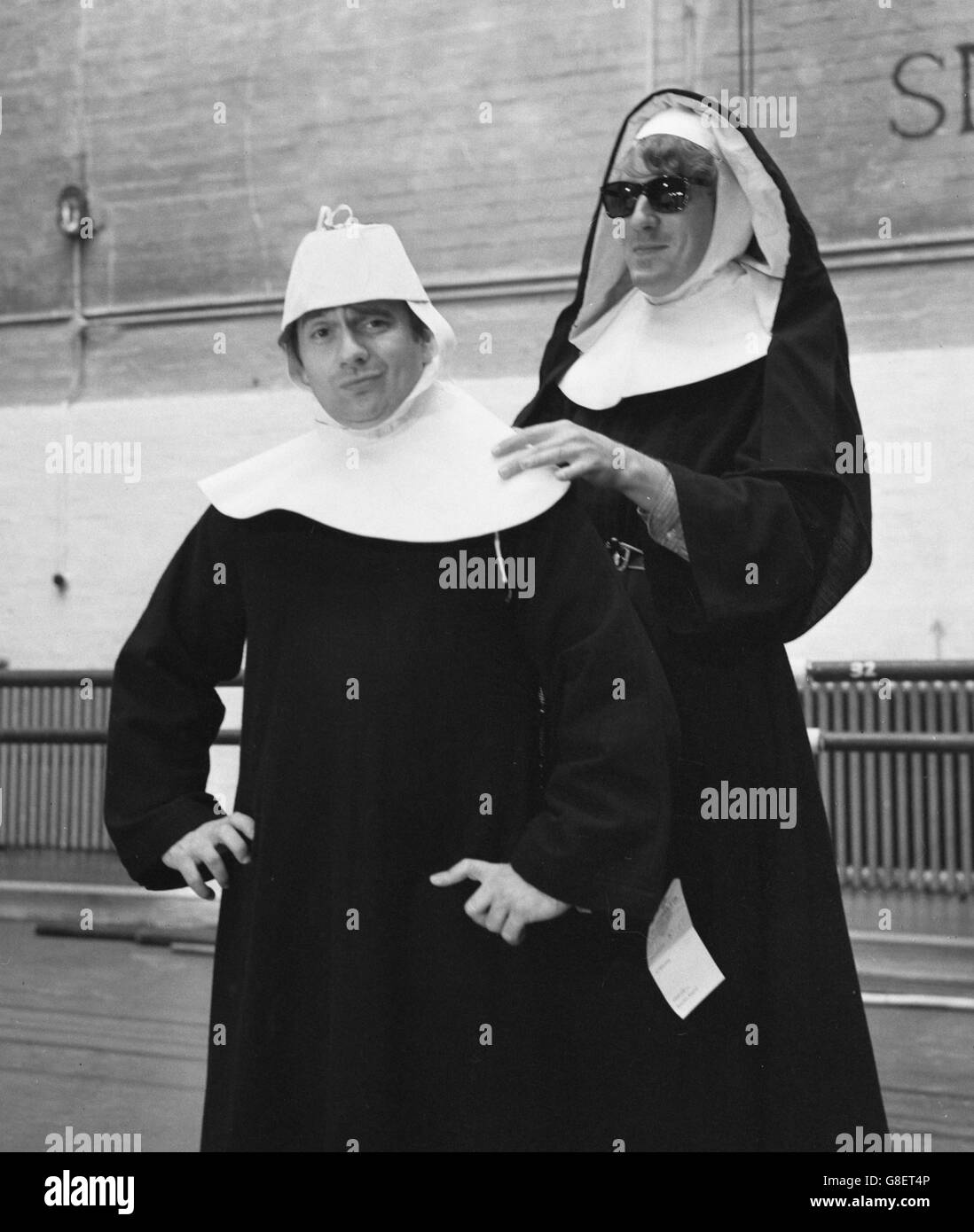 Dudley Moore (left) and Peter Cook rehearse their 'Leaping Nuns' sketch for Cook's revue Rustle of Spring at the Phoenix Theatre, London. The revue opens there on Friday to raise money for the magazine Private Eye to help defray costs of the libel action against it by Lord Russell of Liverpool. Stock Photo