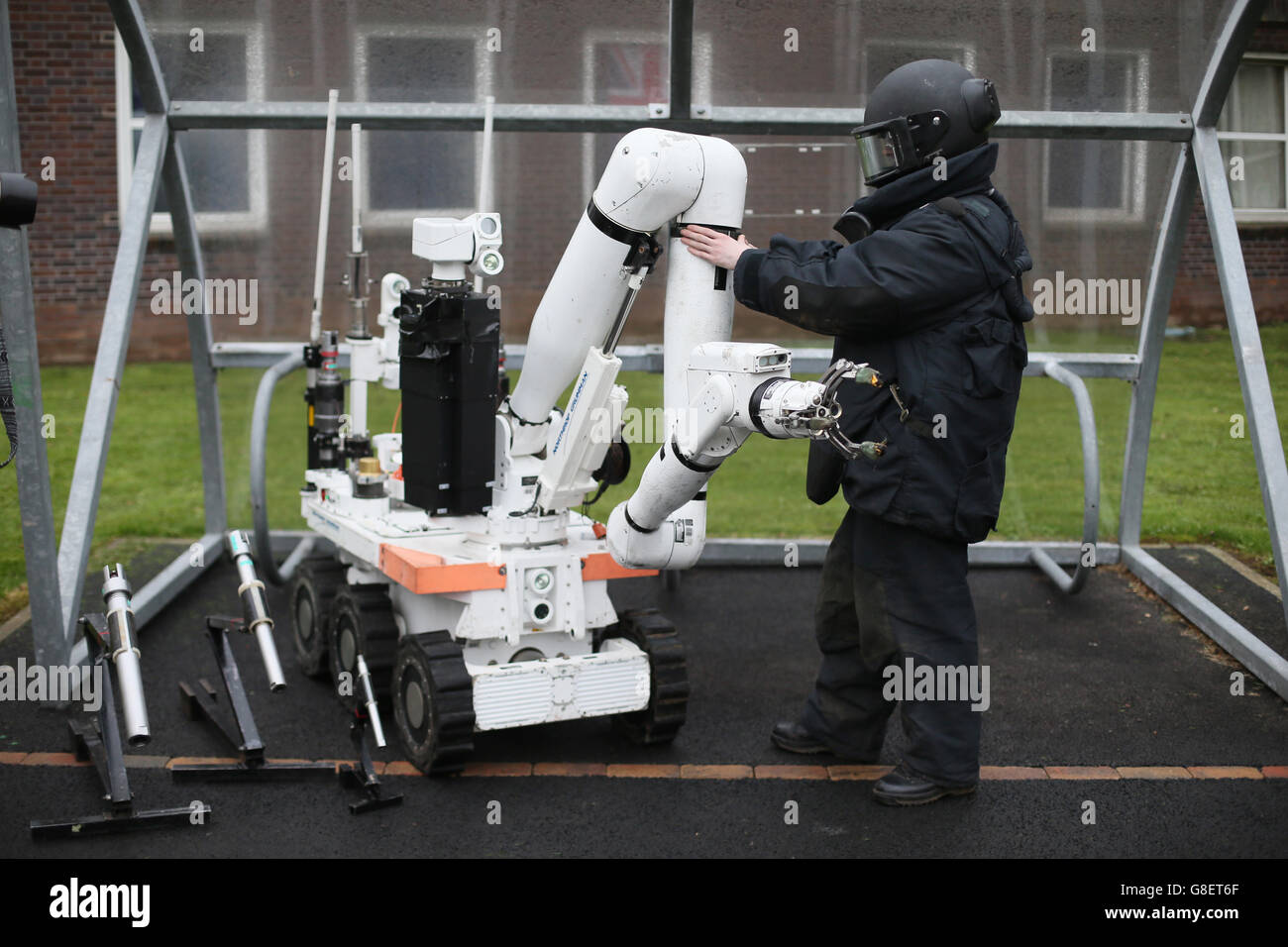 An Army Ammunition Technical Officer beside a Cutless remote controlled Vehicle for bomb disposal, as Northern Irelands emergency services take part in a major review of civil contingency arrangements and put on display the equipment used to deal with crisis and disaster at the Thiepval Barracks in Lisburn. Stock Photo