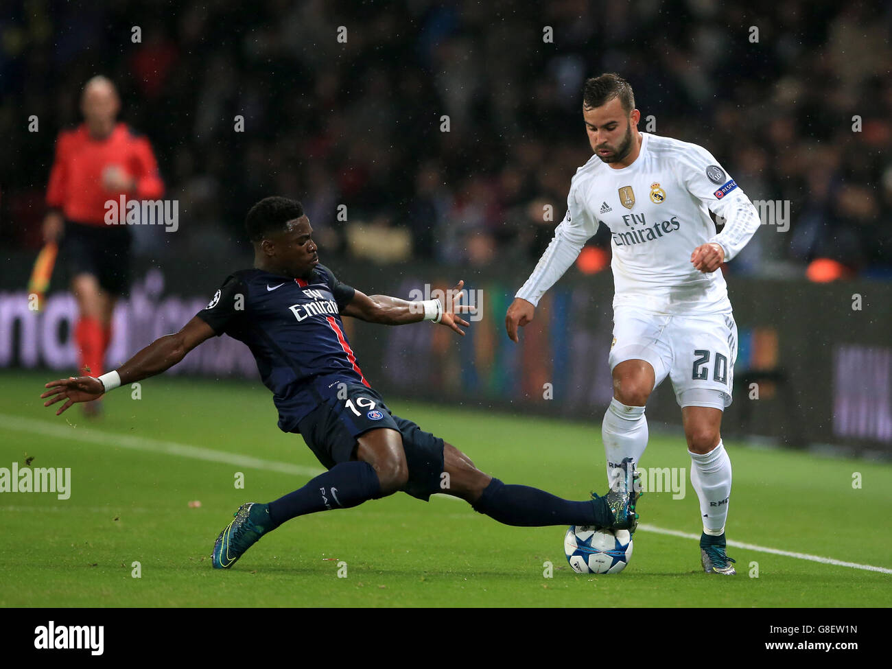 Paris Saint-Germain's Serge Aurier slides in to tackle Real Madrid's Jese (right) Stock Photo