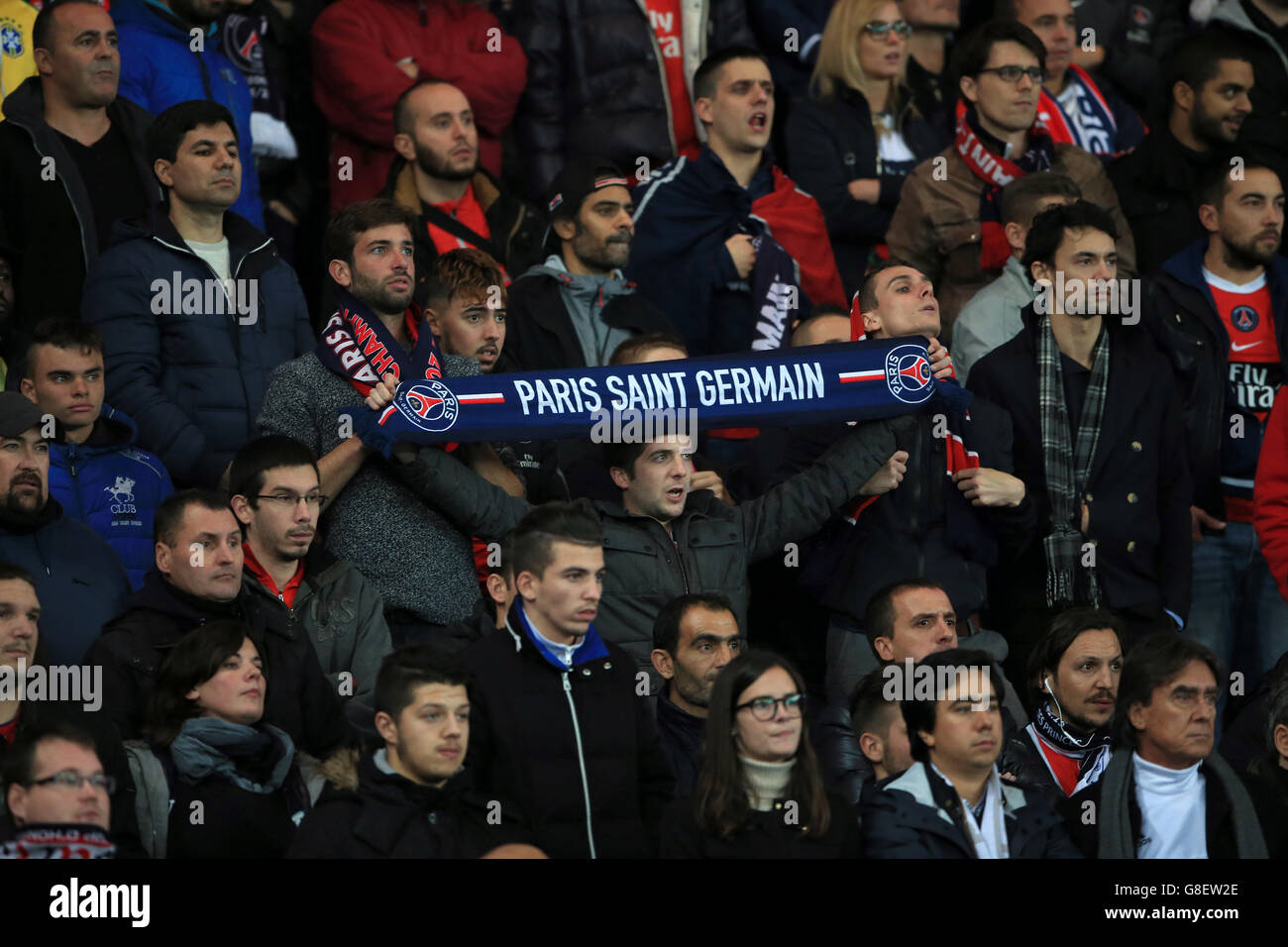 Paris Saint-Germain fans in the stands at the Parc Des Princes Stock Photo