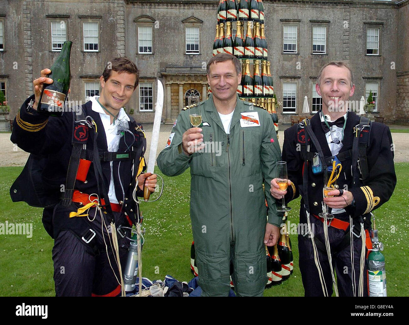 The Champagne Mumm Altitude Challenge team (left to right) Bear Grylls,  David Hempleman-Adams and Royal Navy Lt Cdr Alan Veal celebrate with  champagne, after breaking the the world record for the highest