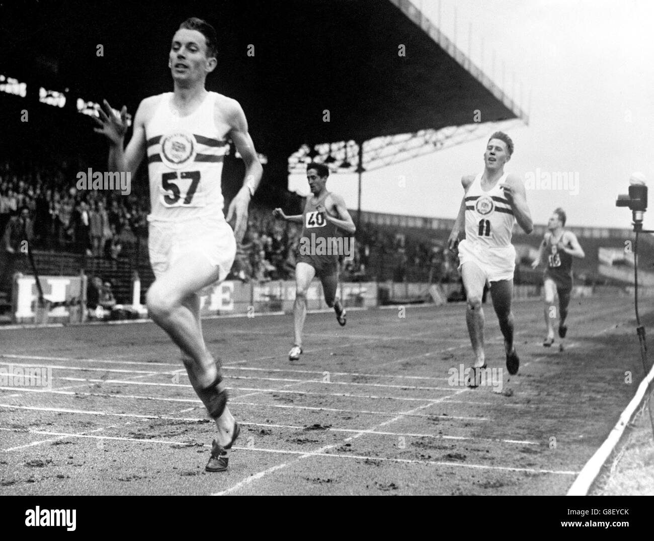 Great Britain's John Parlett (l) wins from teammate Roger Bannister (r) and France's Marcel Hansenne (c) Stock Photo