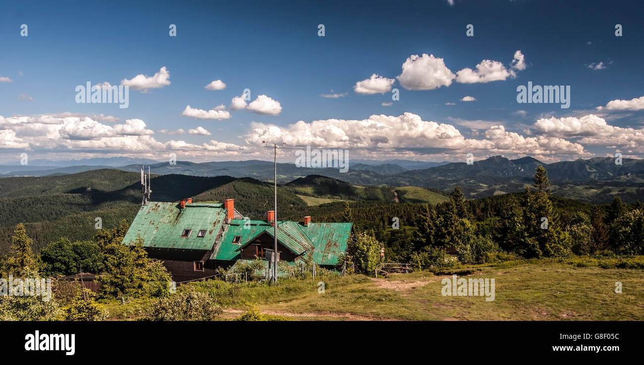 Velka Raca hill with chalet and mountain ranges panorama in Kysucke Beskydy mountains Stock Photo