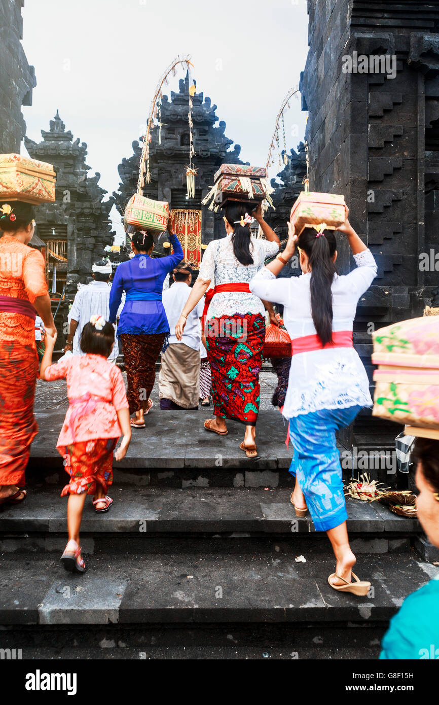 Balinese attending a ritual at a Bali Hindu temple Stock Photo