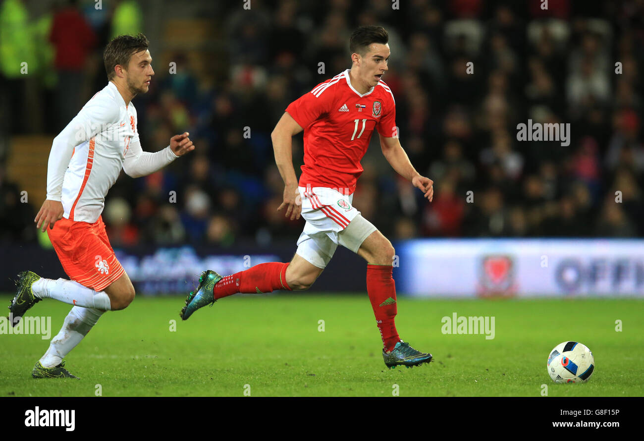 Wales' Tom Lawrence (right) and Netherlands' Joel Veltman battle for the ball during an international friendly at the Cardiff City Stadium, Cardiff. Stock Photo