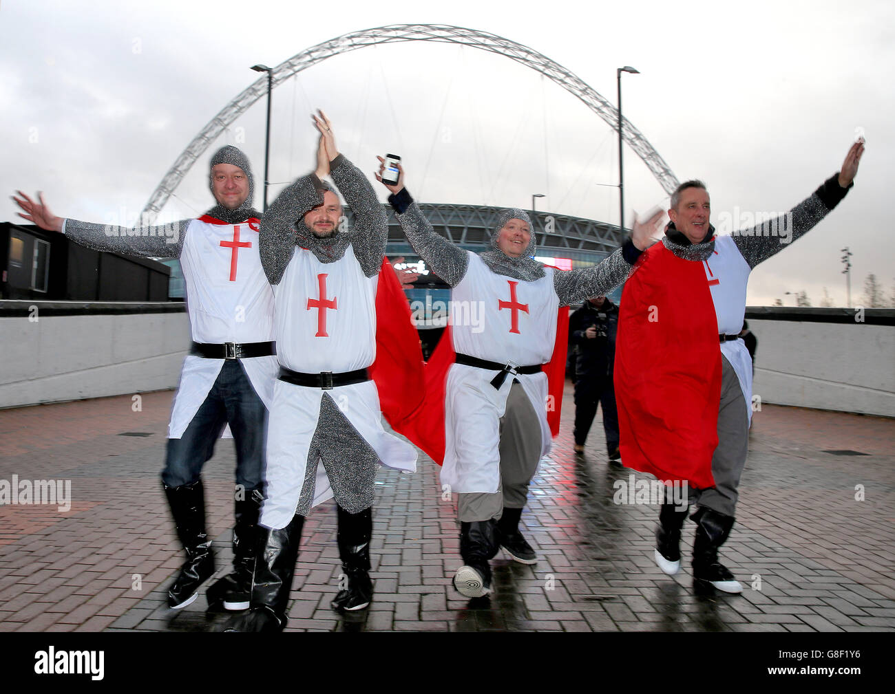 England fans show their support dressed as Templar knights outside the ground before the international friendly match at Wembley Stadium, London. PRESS ASSOCIATION Photo. Picture date: Tuesday November 17, 2015. See PA story SOCCER England. Photo credit should read: Nick Potts/PA Wire. Stock Photo