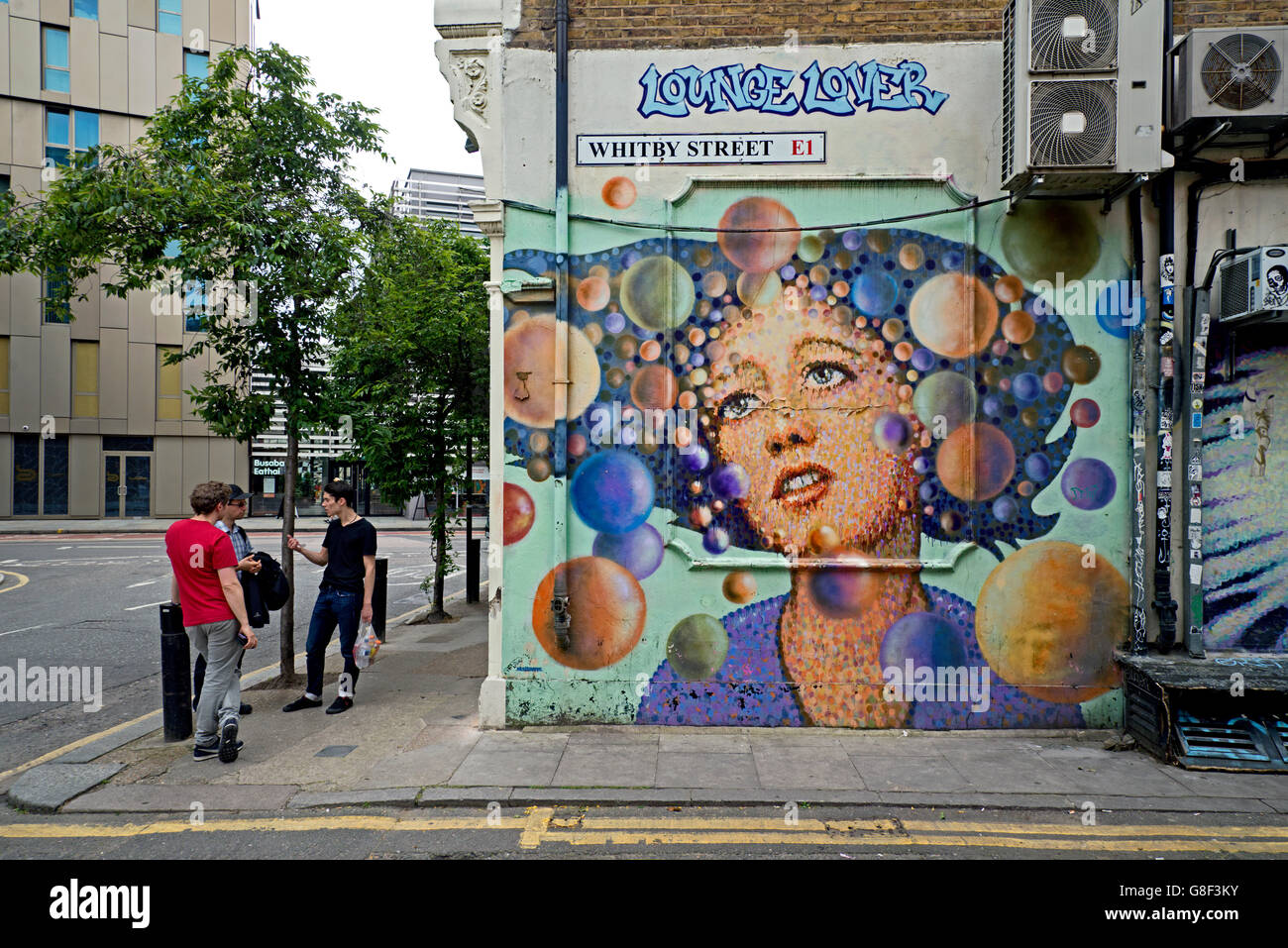 'Lounge Lover' by street artist  James Cochran  in Whitby Street, Shoreditch, East London, UK. Stock Photo