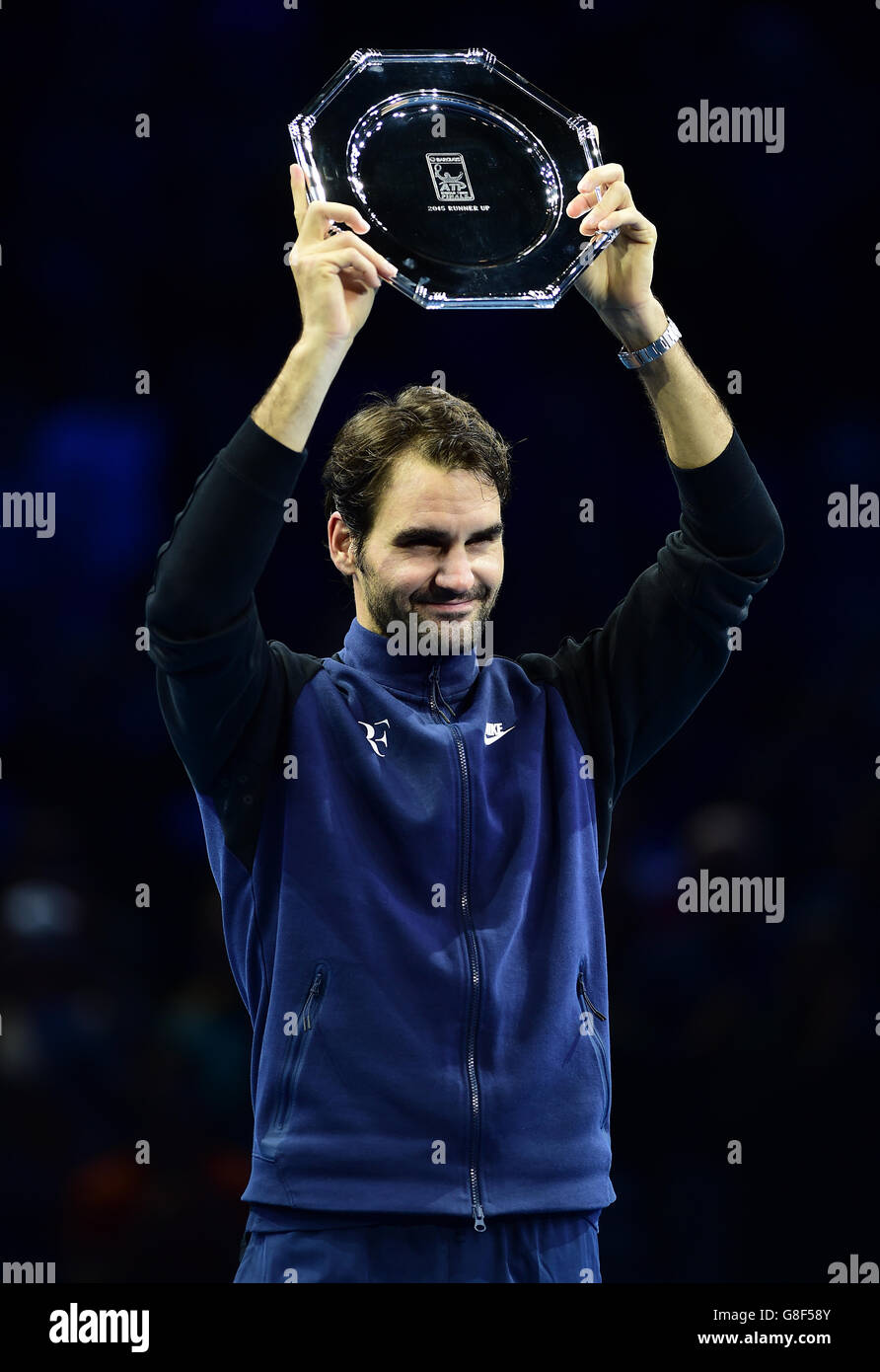 Switzerland's Roger Federer with his runners up trophy after the Final of the ATP World Tour Finals at the O2 Arena, London. PRESS ASSSOCIATION Photo. Picture date: Sunday November 22, 2015. See PA story TENNIS London. Photo credit should read: Adam Davy/PA Wire. Stock Photo
