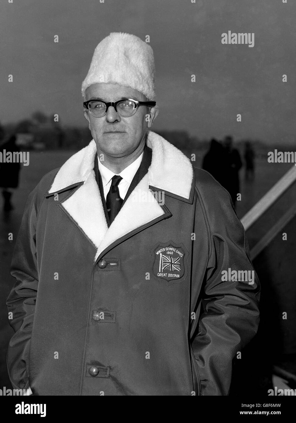 Mr Kenneth Duncan, secretary of the British Olympic Association, sports a 'Macmillan-in-Moscow' hat at London Airport, before he flew to San Francisco, on his way to Squaw valley and the Winter Olympic Games. Stock Photo