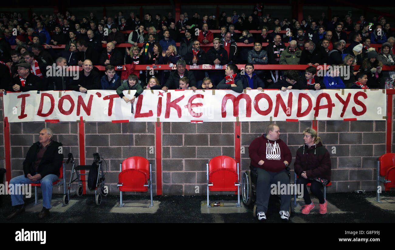 Fans display banners protesting against tonight's match being moved to Monday night for television purposes, before the Emirates FA Cup, First Round match at Broadhurst Park, Manchester. Stock Photo
