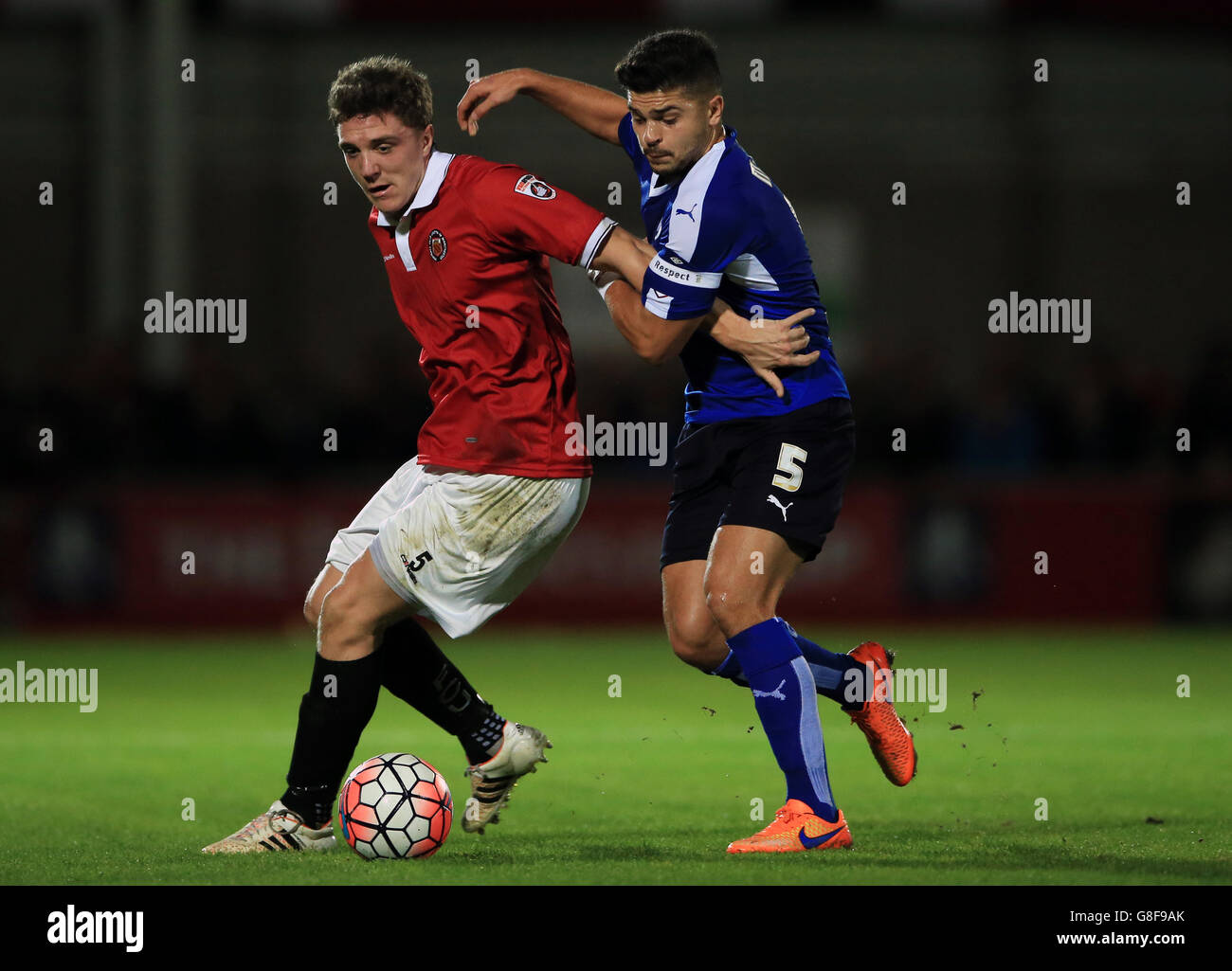 FC United of Manchester's Chris Lynch (left) battles for the ball with Chesterfield's Sam Morsy during the Emirates FA Cup, First Round match at Broadhurst Park, Manchester. Stock Photo