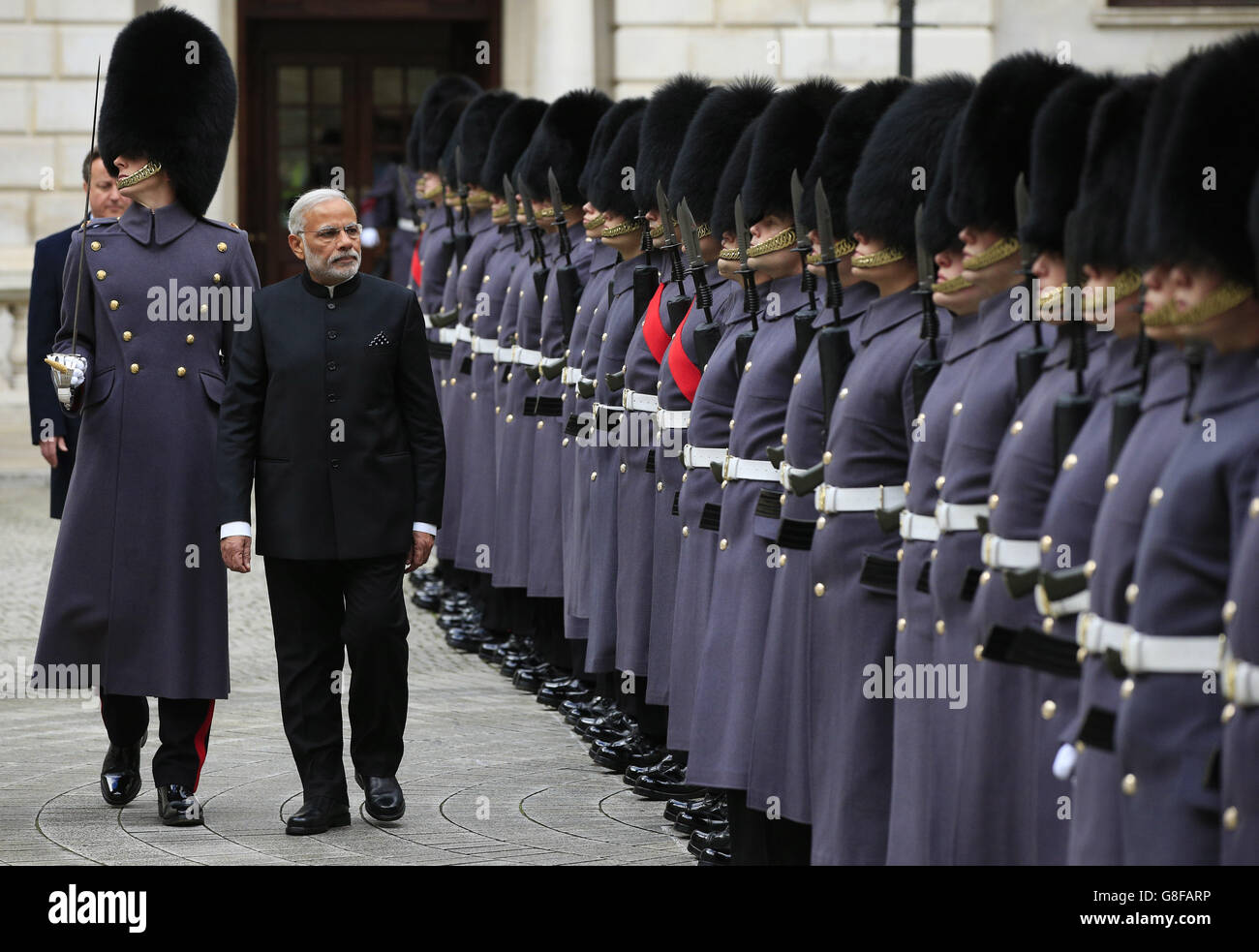 Indian Prime Minister Narendra Modi inspects F Company, The Scots Guards, during his official welcome at The Treasury in London, at the start an official three day visit. Stock Photo