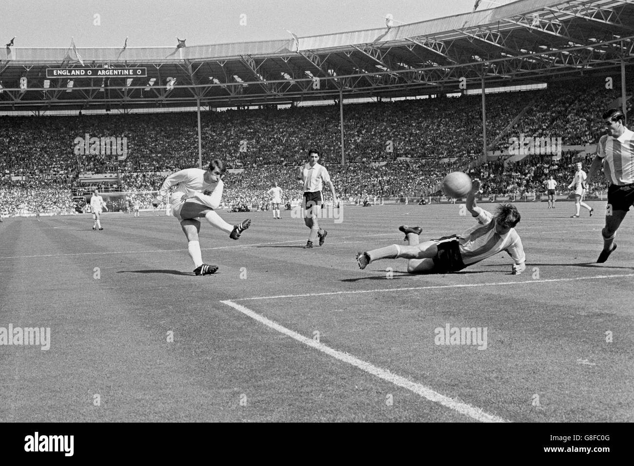 Soccer - World Cup England 1966 - Quarter Final - England v Argentina - Wembley Stadium. England's Geoff Hurst (l) fires a shot at goal Stock Photo