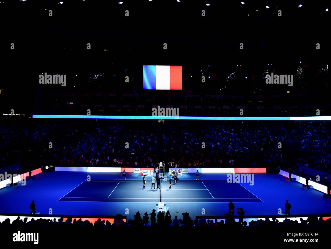 Serbia's Novak Djokovic and Japan's Kei Nishikori stand for a minutes silence in memory of the Paris victims during day one of the ATP World Tour Finals at the O2 Arena, London. PRESS ASSSOCIATION Photo. Picture date: Sunday November 15, 2015. See PA story TENNIS London. Photo credit should read: Adam Davy/PA Wire Stock Photo